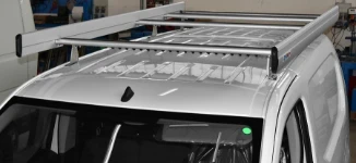 A Peugeot Partner with a roof rack