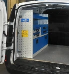 An enclosed wheel arch compartment, drawers, cases and shelves in the Citan