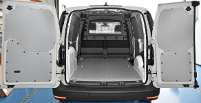 Resin-coated marine plywood floor and sheet-metal lining for the Caddy
